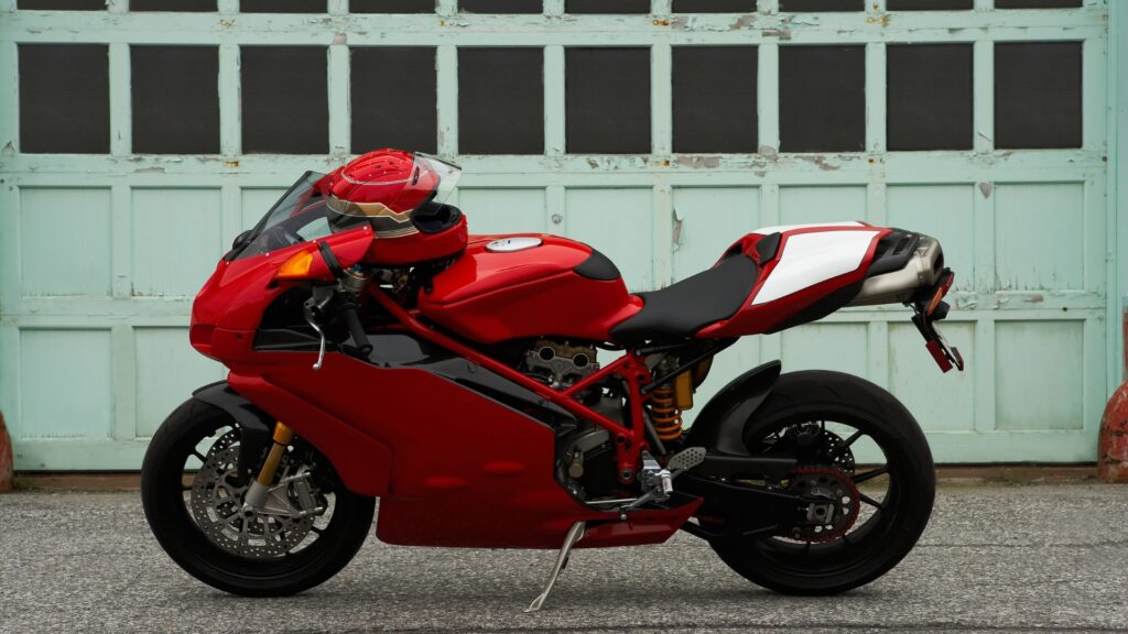 Motorcycle displayed in Honda dealership showroom as part of the blog post on building brand awareness for motorcycle companies. Red Ducati motorcycle symbolizing brand awareness for motorcycle brands